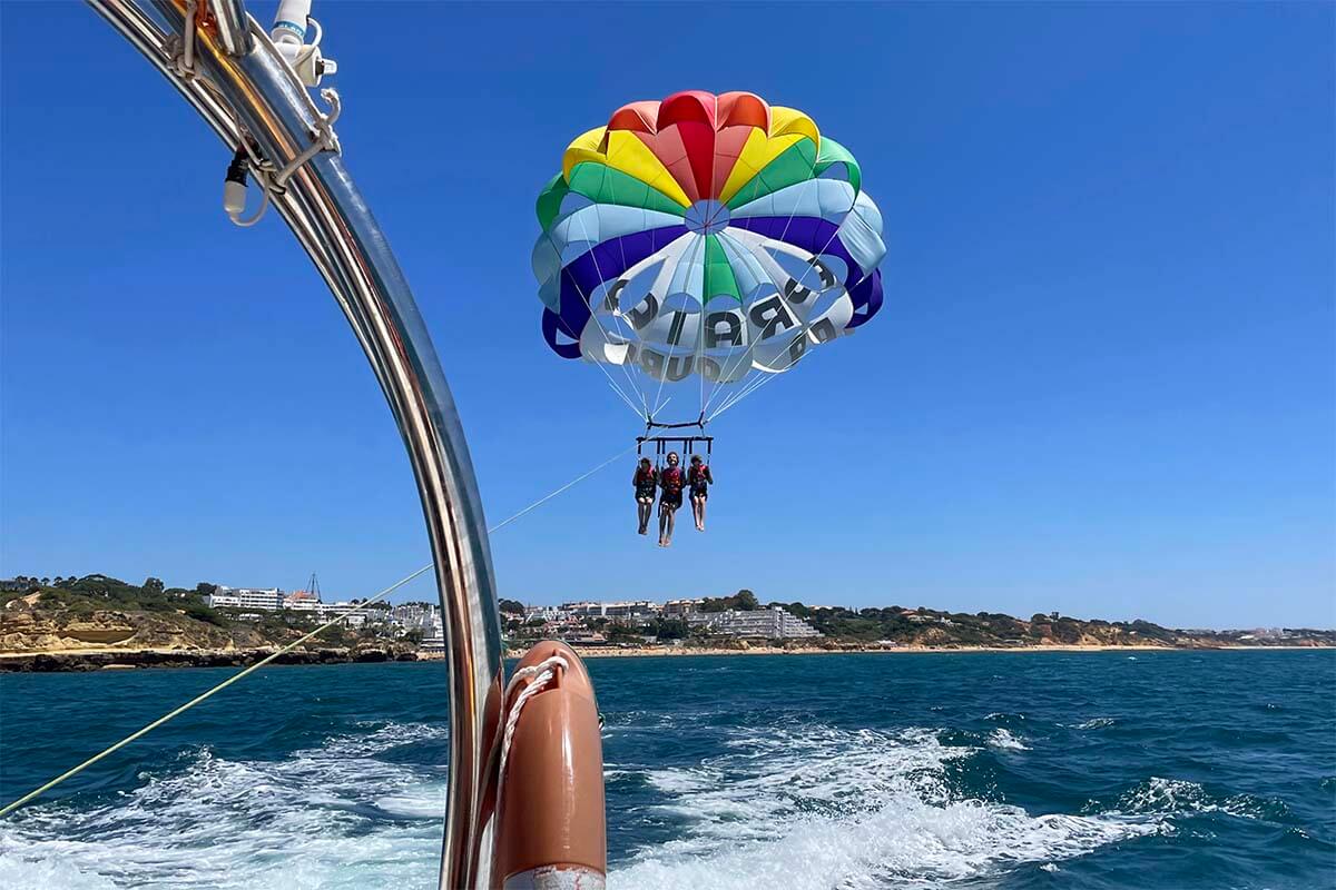 Kids parasailing in Algarve in summer