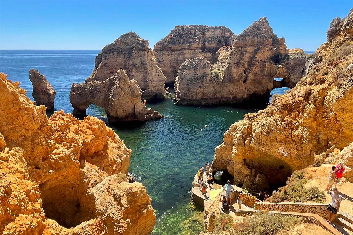 Tourists at Ponta da Piedade in Lagos on a sunny summer day end of July