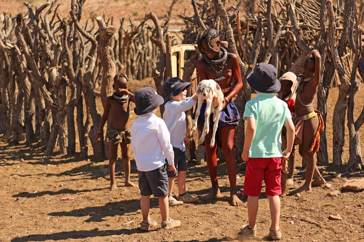 Our kids meeting Himba children in Namibia
