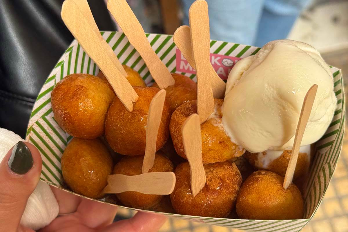 Loukoumades, small Greek donuts with honey and cinnamon served with ice cream on our food tour in Athens